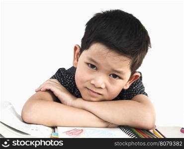Asian kid is happily preparing for reading a book, isolated over white