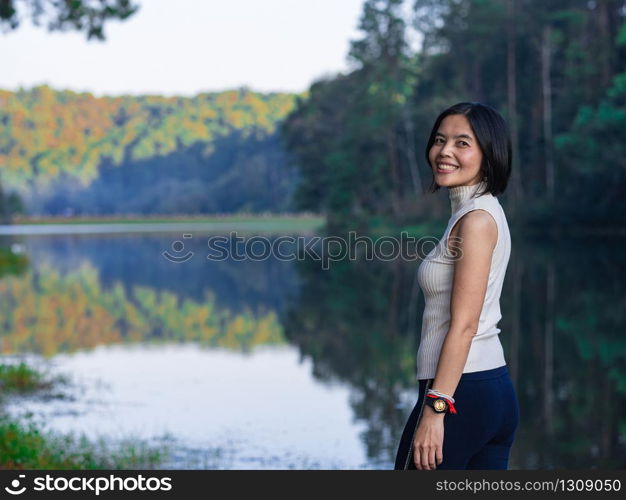 Asian lady standing at Pang Oung lake