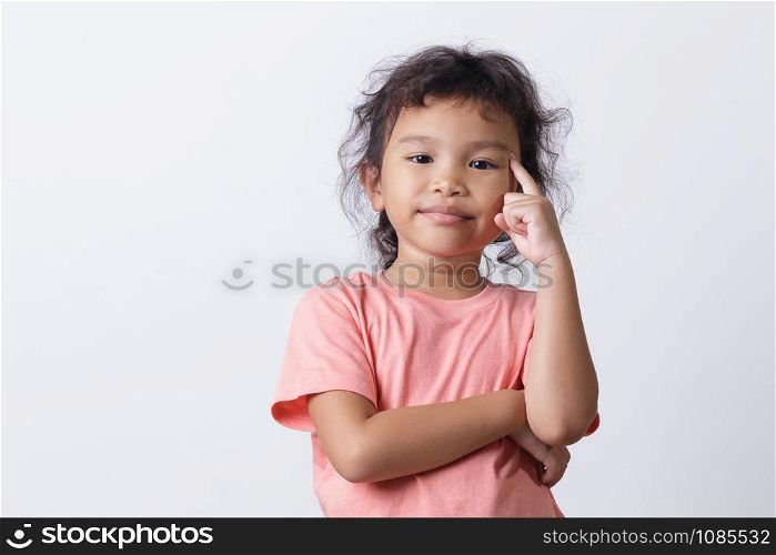 Asian little girl thinking while standing on white background