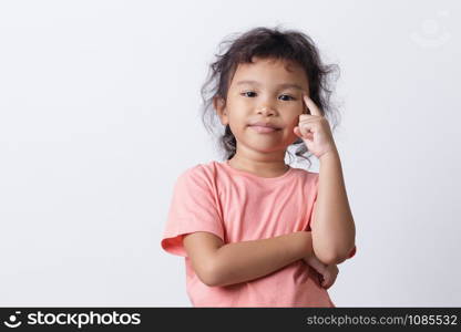 Asian little girl thinking while standing on white background