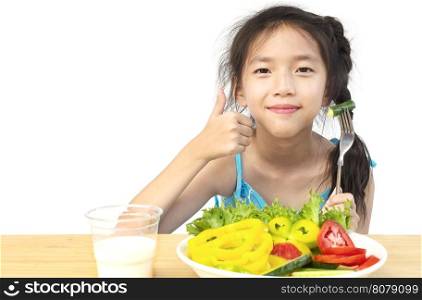 Asian lovely girl showing enjoy expression with fresh colorful vegetables and glass of milk isolated over white background