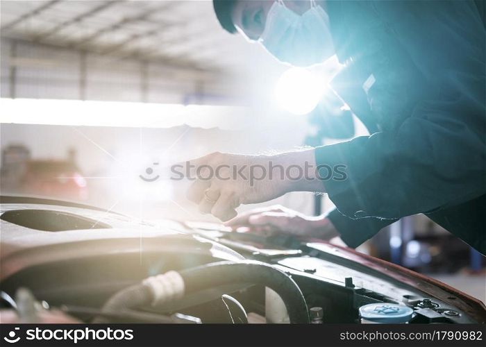 Asian man car inspection holding taplet application for service car for car futuristic vehicle graphical GUI interface intelligent. connected car. Internet display technician maintenance