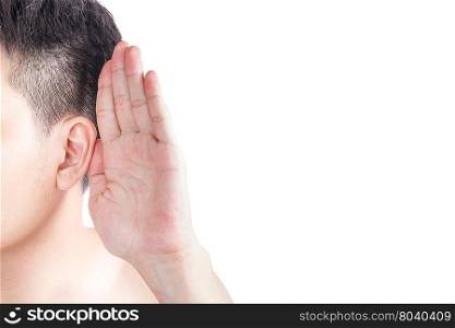 Asian man holds his hand near his ear and listening
