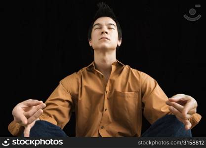 Asian man in yoga pose