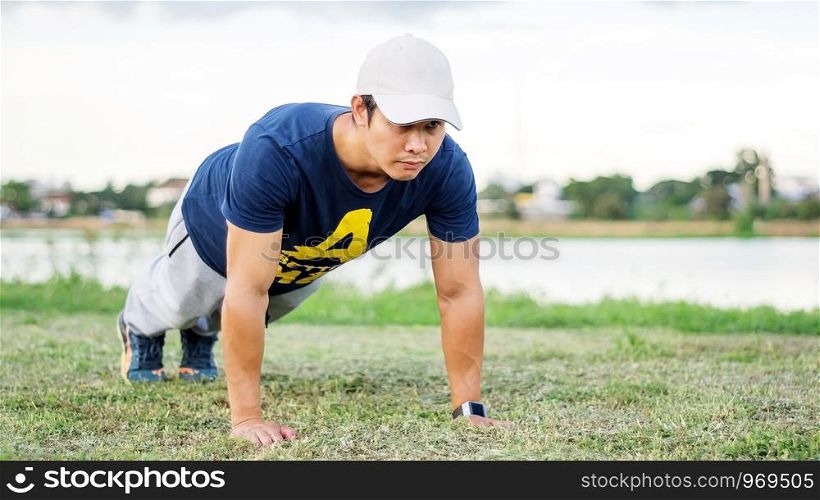 Asian man prepares for a workout at the public park.