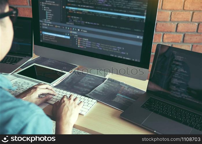 Asian man working code program developer computer web development working design software on desk in office.