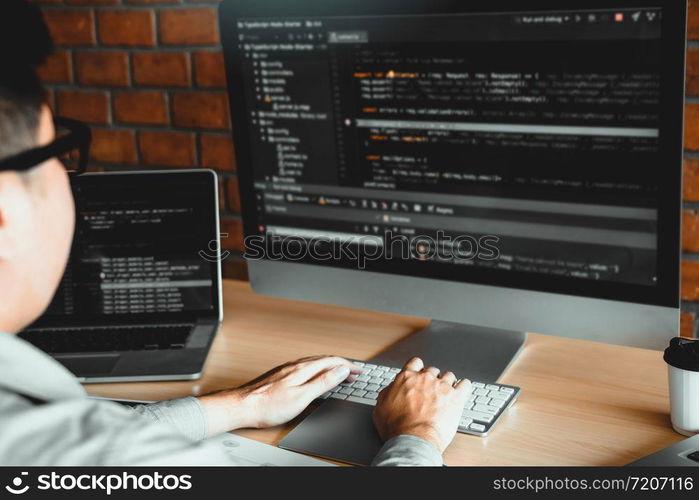 Asian man working code program developer computer web development working design software on desk in office.