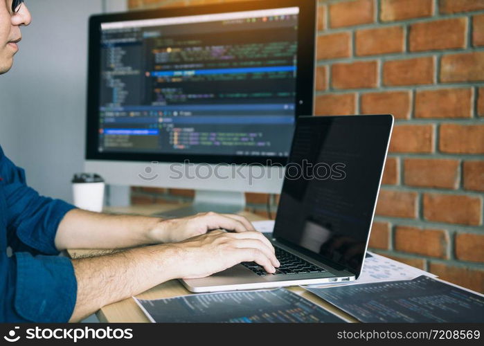 Asian man working code program developer computer web development working design software on desk in office.