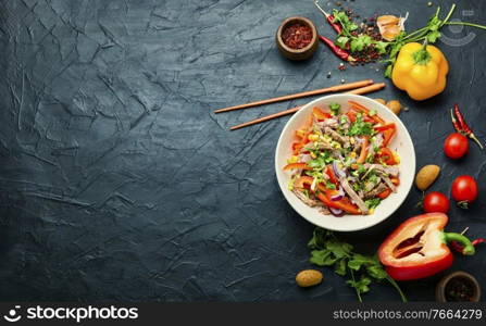 Asian meat salad with beef,pepper,tomato and corn. Spring salad.Copy space. Asian salad with vegetables and meat