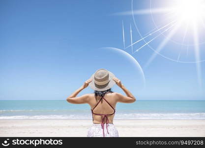 Asian model wear red swimsuit and straw hat stand on beach look view on hot day, Sun and UV rays hit the beautiful woman’s protective layer. concept about of spa, sunscreen, cosmetics, health.