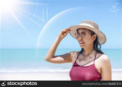 Asian model wear red swimsuit and straw hat stand on beach look view on hot day, Sun and UV rays hit the beautiful woman’s protective layer. concept about of spa, sunscreen, cosmetics, health.