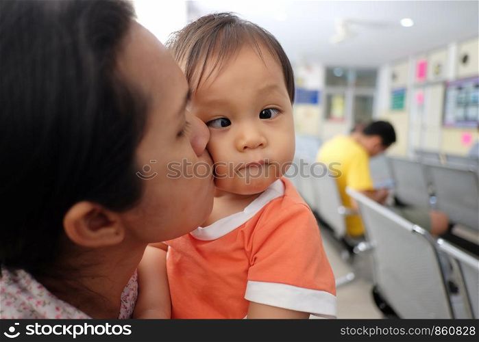 Asian mother carrying a baby,concept for mother's love for the baby in happiness.