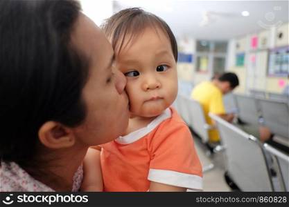 Asian mother carrying a baby,concept for mother's love for the baby in happiness.