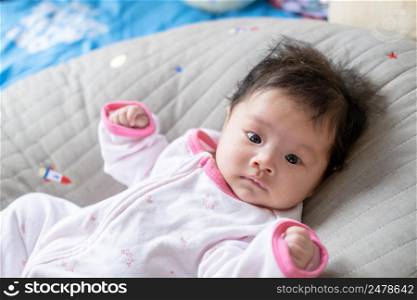 Asian newborn baby kid eye contact with mom cuteness of children with happy family on soft mattress metaphor living life healthy lifestyle cute of kid baby products health products for mother and baby