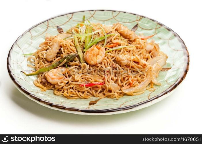 asian noodle dish with vegetables and seafood