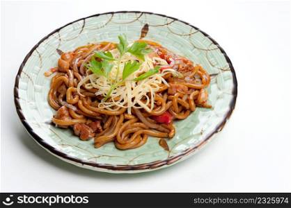 asian noodle dish with vegetables and seafood