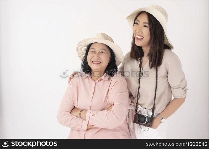 Asian older woman and her daughter on white background, Travel concept