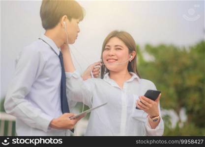 Asian people use mobile smart phone tablet smart technology soft focus