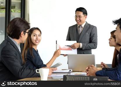 asian professional businessman present financial chart with team in the meeting, selective focus