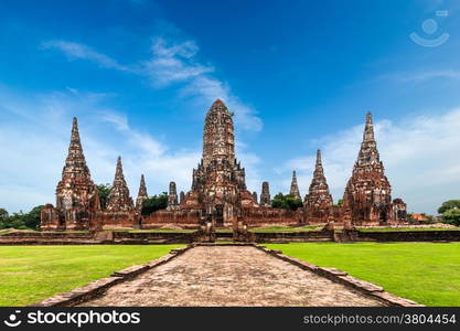 Asian religious architecture. Amazing panorama view of ancient Chai Watthanaram temple ruins under blue sky. Ayutthaya, Thailand travel landscape and destinations