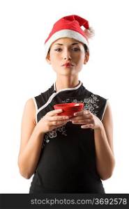 asian santa claus girl holding traditional red chinese cup for rice