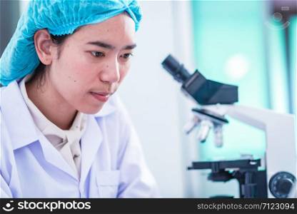Asian scientist has researching in laboratory, chemical lab