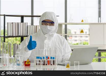 Asian scientist posing confidently in the laboratory.