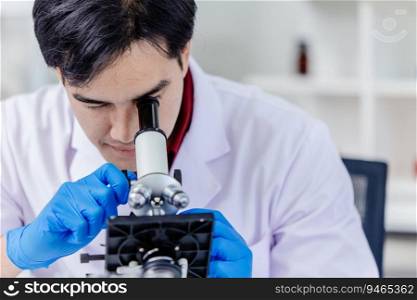 Asian scientist researcher looking at microscope working in medical lab.