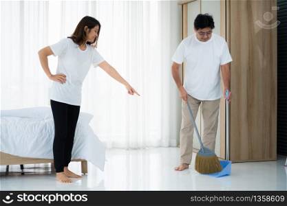 Asian senior couple cleaning bedroom floor. Retirement and healthy elderly concept.