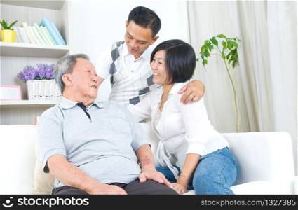 Asian senior father with his adult son and daughter at home. Family living lifestyle.