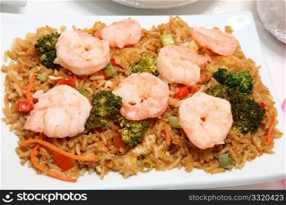 Asian shrimp fried rice with broccoli, carrot, scallion, ginger.