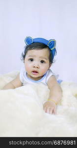 Asian Smiling baby girl . Asian Smiling baby girl crawling in bedroom