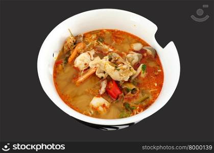 Asian spicy seafood noodle soup, Thai style instant seafood noodle soup, in ceramic bowl