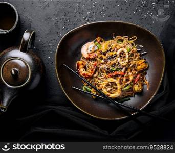 Asian spicy wok with noodles, shrimps and vegetables
