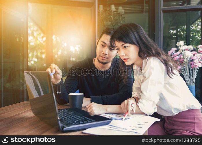 asian start up ,freelance team working with computer laptop at home office