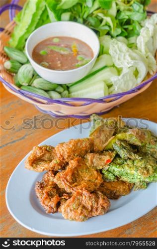 asian style food. omelet with Climbing Wattle and fried fish cakes served with fresh vegetables and spicy sauce