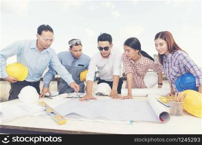 Asian team engineer working in construction site. construction concept