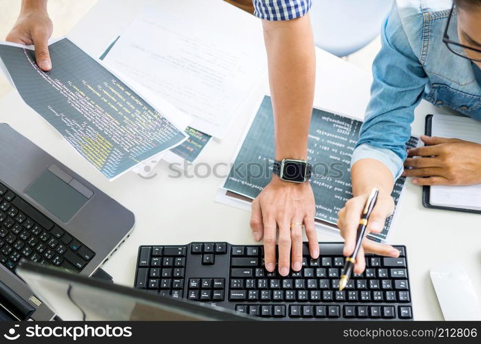 Asian team Outsource Developer Looking Screen Programming Code Working with Laptop Computer Software