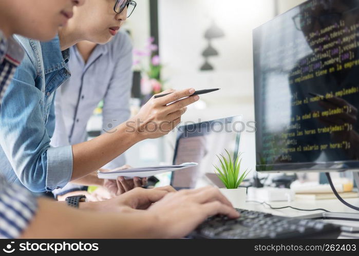 Asian team Outsource Developer Looking Screen Programming Code Working with Laptop Computer Software
