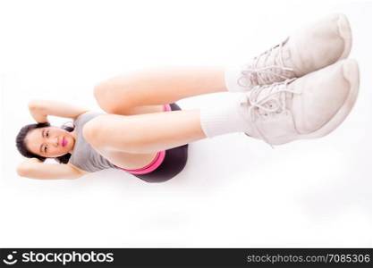 Asian teenage girl doing situps on white background