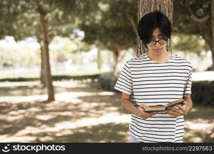 asian teenage student with opened book