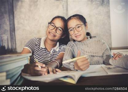 asian teenager happiness emotion doing school home work
