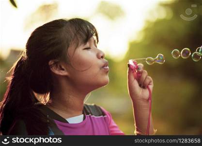 asian teenager relaxing with soup bubble