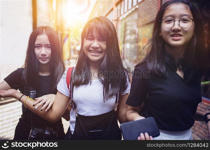 asian teenager smiling face happiness emotion walking in citylife street