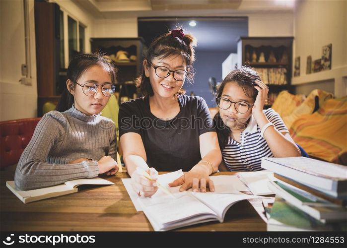 asian teenager student and woman teacher toothy smiling face in modern class room