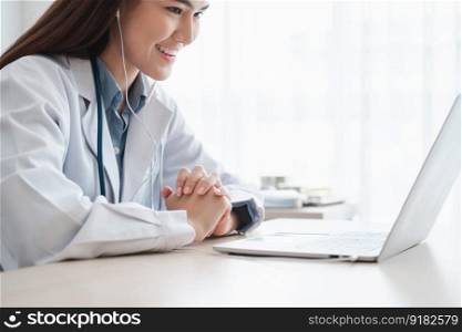 Asian therapist woman doctor is online visiting with a patient on the internet application. Her Listening and Give advice and explains how to treat the initial disease, Concept of Medical technology.
