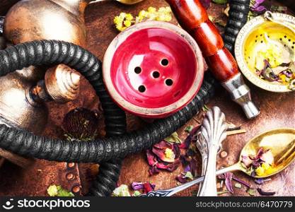 Asian tobacco hookah with floral tea aroma. Smoke hookah with herbal floral tea.Shisha concept.Hookah concept