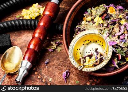 Asian tobacco hookah with floral tea aroma. Smoke hookah with herbal floral tea.Shisha concept.Hookah concept