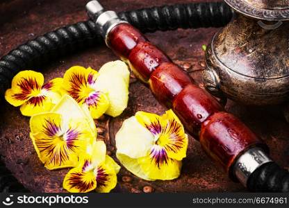 Asian tobacco hookah with flower aroma. Arabia smoke hookah with floral.Shisha concept.Hookah concept