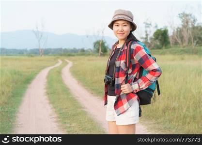 Asian tourist woman . Nature mountain view A young girl is traveling on summer vacation.